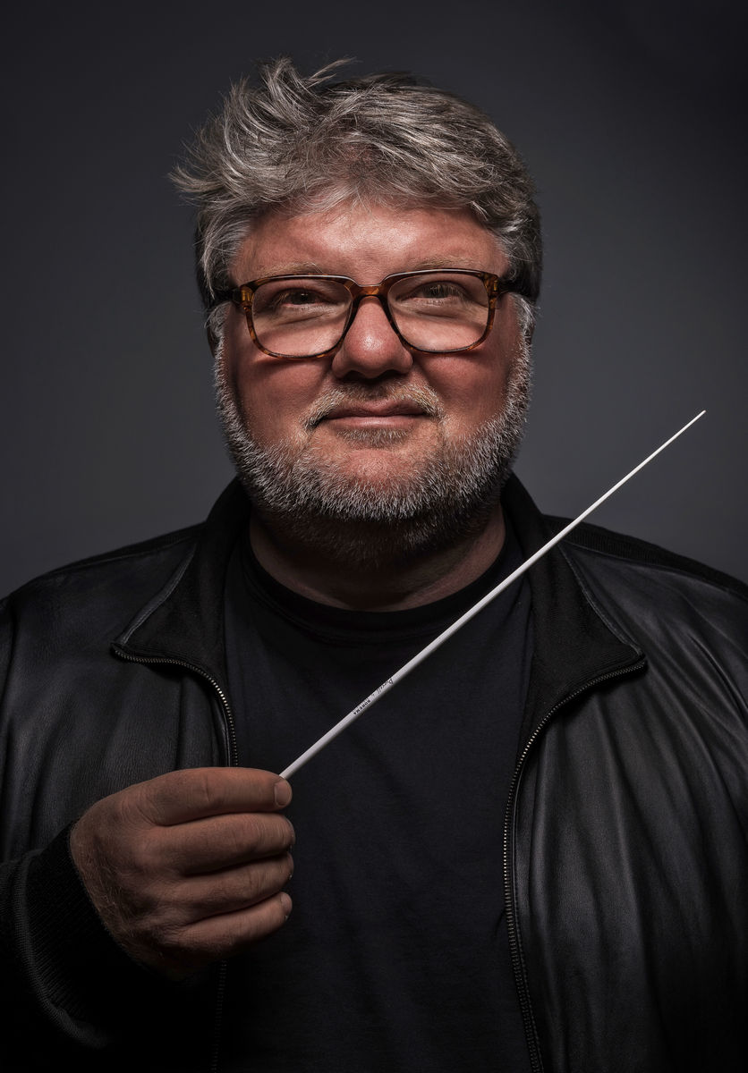 Conductor Dmitry Yablonsky directing the orchestra
